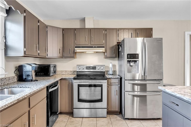 kitchen with under cabinet range hood, gray cabinets, stainless steel appliances, and a sink