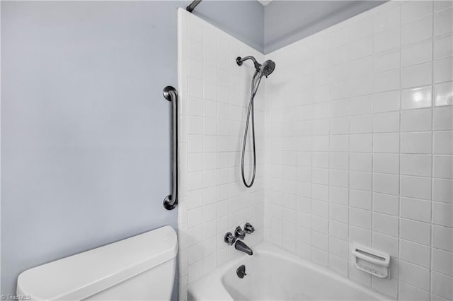 bathroom with toilet and bathtub / shower combination