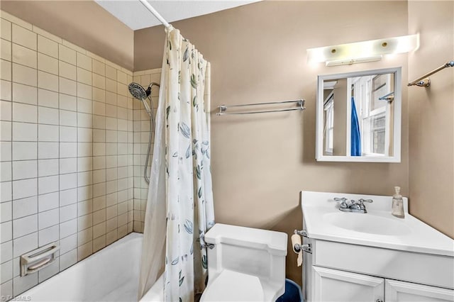 bathroom featuring vanity, toilet, and shower / bath combo with shower curtain