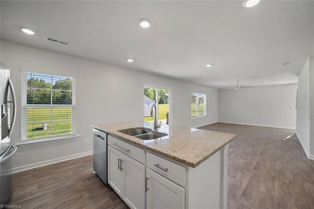 kitchen featuring a ceiling fan, a sink, white cabinetry, baseboards, and appliances with stainless steel finishes