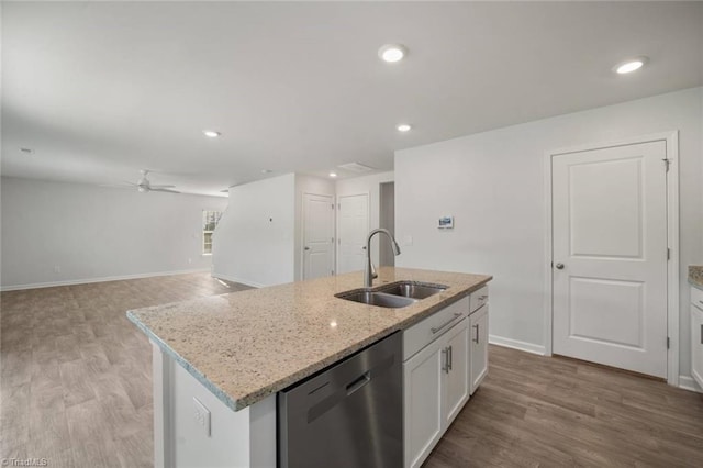 kitchen with a ceiling fan, a sink, white cabinets, light wood-type flooring, and dishwasher