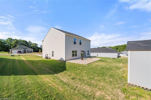 back of property with a yard, a patio area, and cooling unit