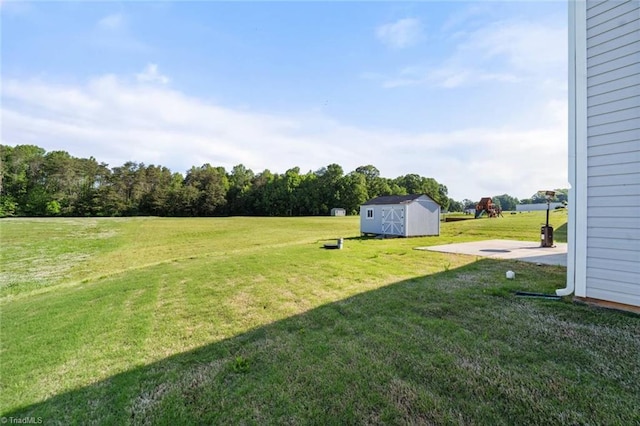 view of yard with an outbuilding and a storage shed