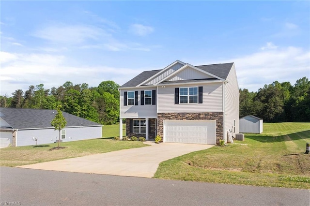 craftsman-style home featuring concrete driveway, stone siding, a front yard, and a garage