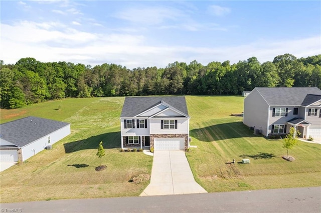 birds eye view of property featuring a view of trees
