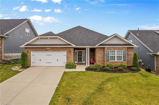 craftsman house with a garage and a front lawn