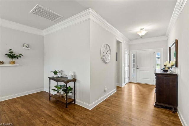 entryway featuring wood-type flooring and ornamental molding