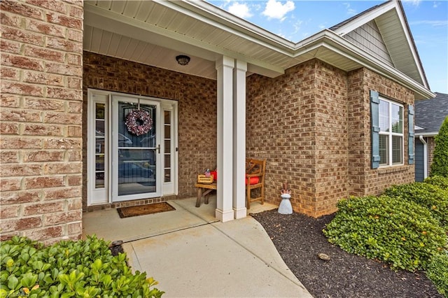 doorway to property with covered porch