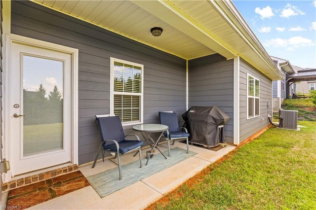 view of patio with central air condition unit and a grill