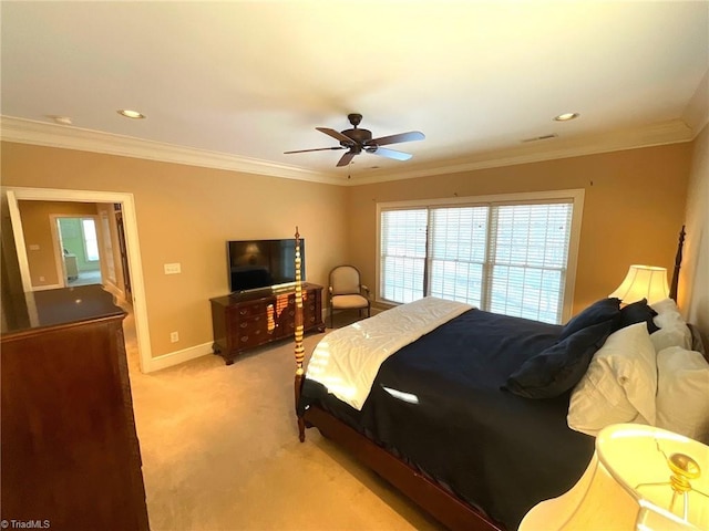 bedroom featuring ceiling fan, crown molding, and light carpet