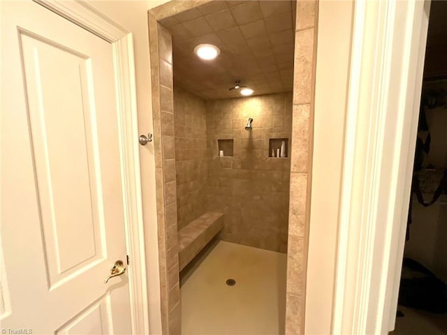 bathroom featuring tiled shower