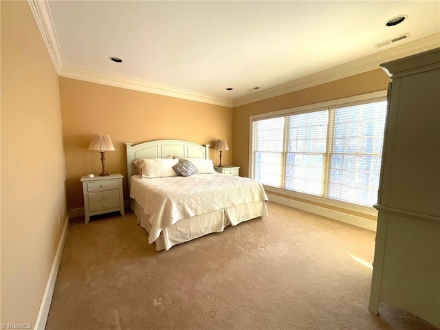 bedroom with crown molding and carpet