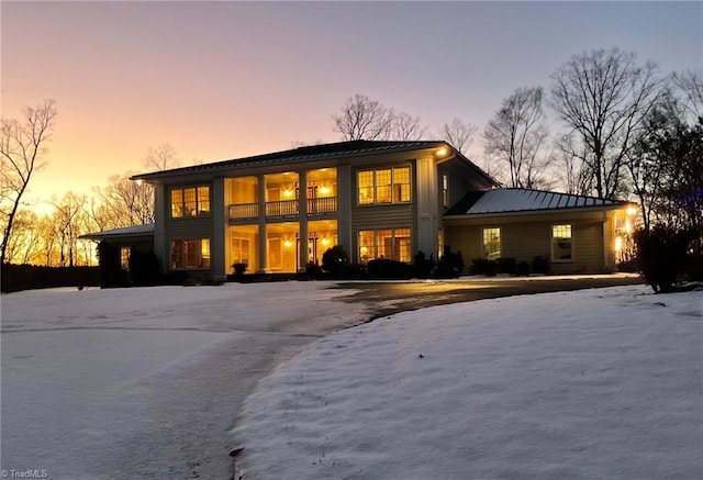 view of back house at dusk