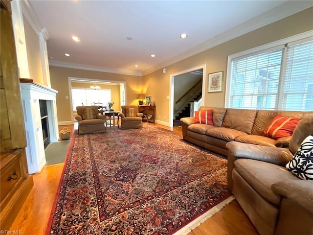 living room with hardwood / wood-style floors and ornamental molding