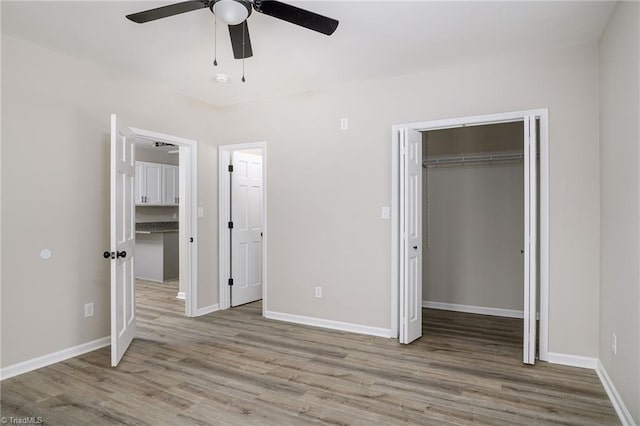 unfurnished bedroom featuring ceiling fan and light hardwood / wood-style floors