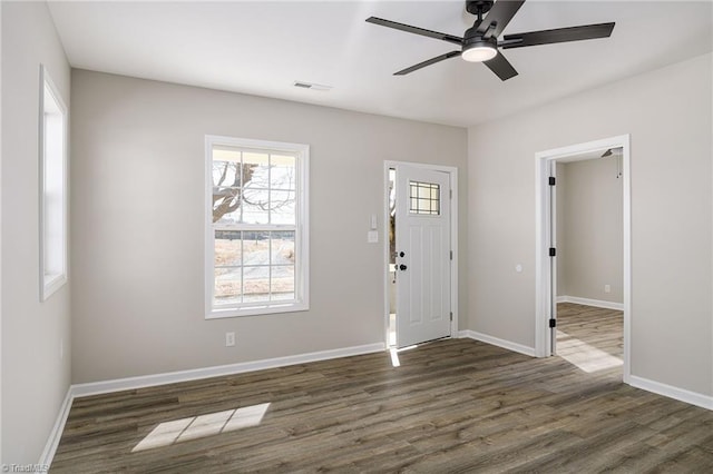 foyer with dark hardwood / wood-style floors and ceiling fan