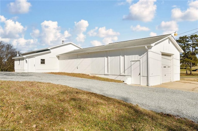 view of property exterior featuring a garage