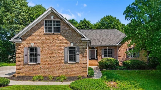 920 James Doak Pkwy, Greensboro, NC 27455 - traditional-style house featuring a front lawn and brick siding