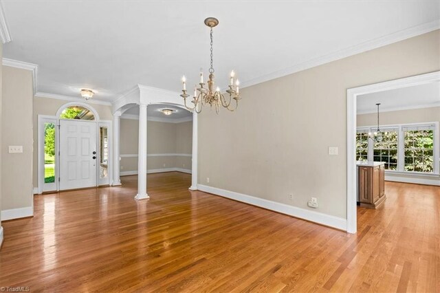920 James Doak Pkwy, Greensboro, NC 27455 - empty room with light wood-type flooring, decorative columns, healthy amount of natural light, and ornamental molding
