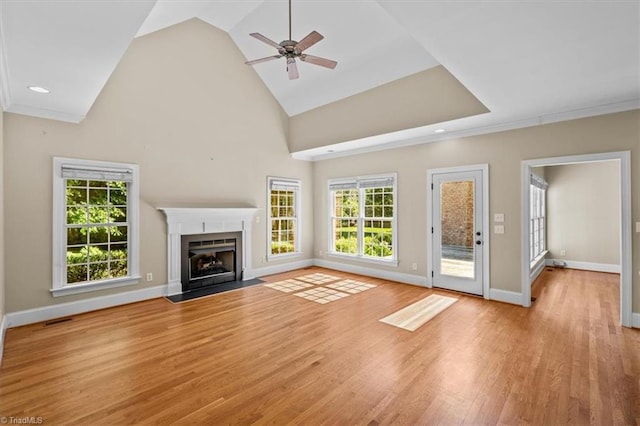 920 James Doak Pkwy, Greensboro, NC 27455 - unfurnished living room featuring a fireplace with flush hearth, ceiling fan, light wood-type flooring, high vaulted ceiling, and recessed lighting
