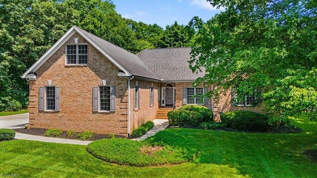 920 James Doak Pkwy, Greensboro, NC 27455 - view of front of property with a front yard and brick siding