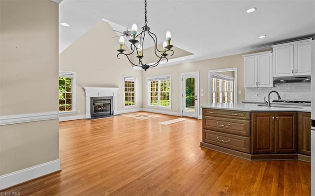 920 James Doak Pkwy, Greensboro, NC 27455 - kitchen with a chandelier, healthy amount of natural light, light countertops, white cabinets, and recessed lighting