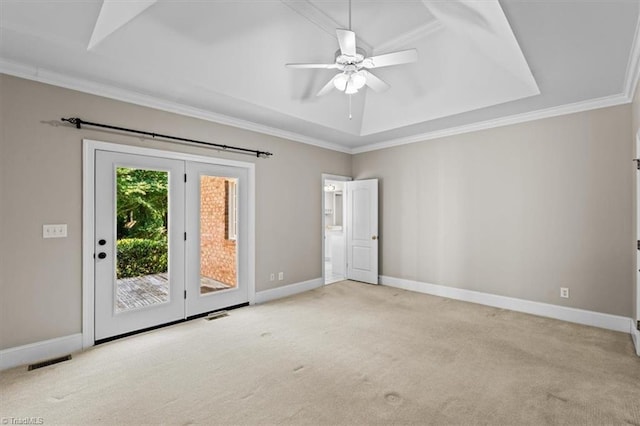 920 James Doak Pkwy, Greensboro, NC 27455 - unfurnished room with carpet flooring, a tray ceiling, crown molding, and a ceiling fan