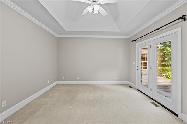 920 James Doak Pkwy, Greensboro, NC 27455 - unfurnished room featuring a tray ceiling, ceiling fan, light carpet, and ornamental molding