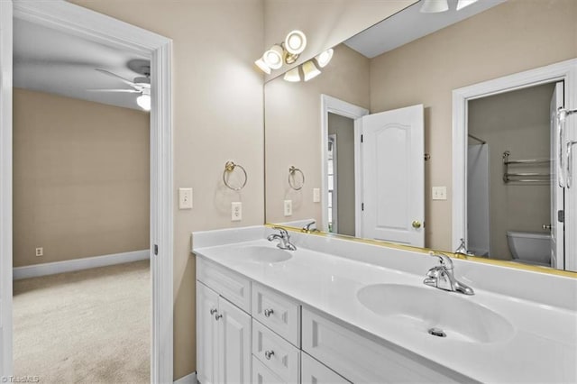 920 James Doak Pkwy, Greensboro, NC 27455 - bathroom featuring ceiling fan and double vanity