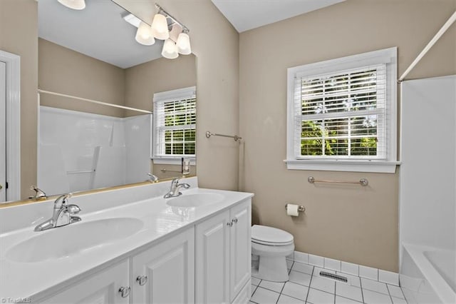 920 James Doak Pkwy, Greensboro, NC 27455 - full bathroom featuring double vanity, tile patterned floors, and  shower combination