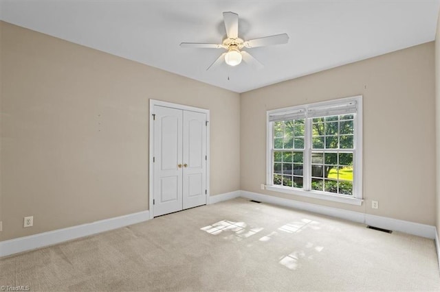 920 James Doak Pkwy, Greensboro, NC 27455 - unfurnished bedroom featuring carpet, a closet, and ceiling fan