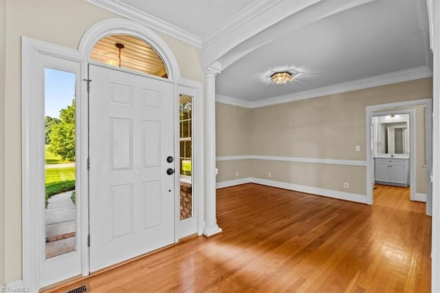 920 James Doak Pkwy, Greensboro, NC 27455 - entryway with ornate columns, wood finished floors, and crown molding