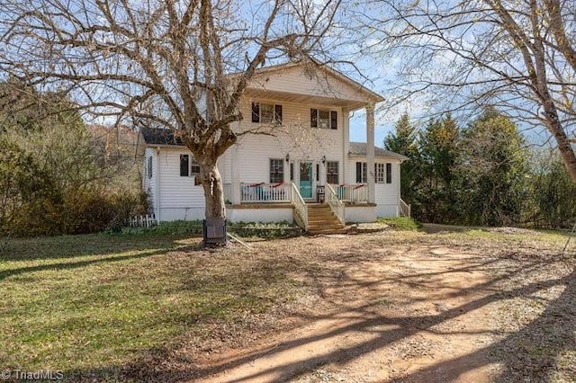 neoclassical home with a front lawn