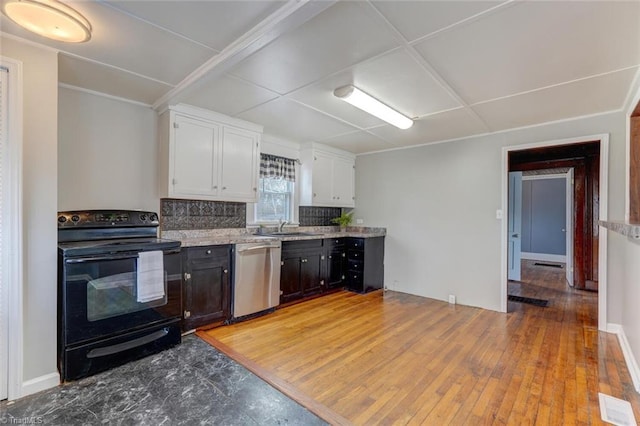 kitchen with visible vents, a sink, black / electric stove, white cabinets, and dishwasher