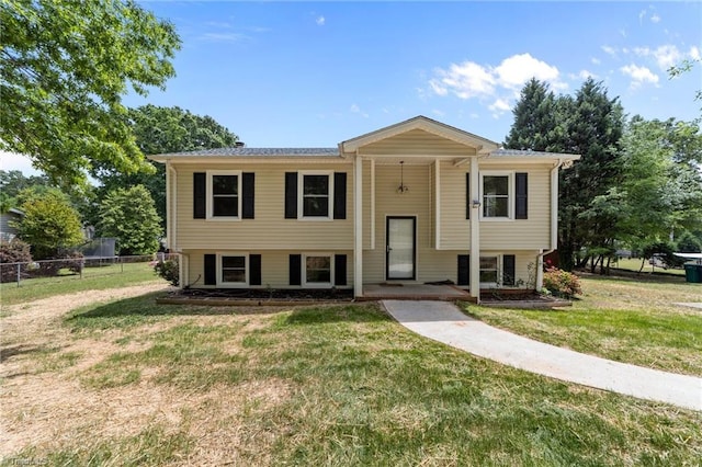131 Springdale Dr, Stoneville, NC 27048 - split foyer home with a front lawn and fence