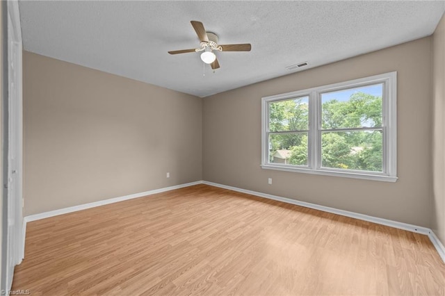 131 Springdale Dr, Stoneville, NC 27048 - empty room with baseboards, ceiling fan, light wood-type flooring, and visible vents
