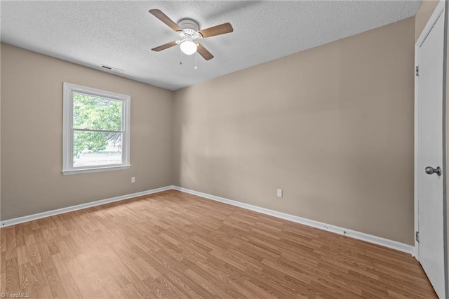 131 Springdale Dr, Stoneville, NC 27048 - unfurnished room featuring a ceiling fan, a textured ceiling, visible vents, and light wood-style floors