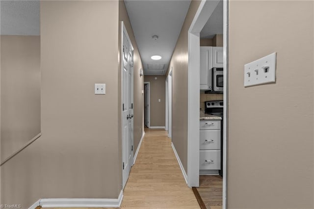 131 Springdale Dr, Stoneville, NC 27048 - corridor featuring baseboards and light wood-style flooring