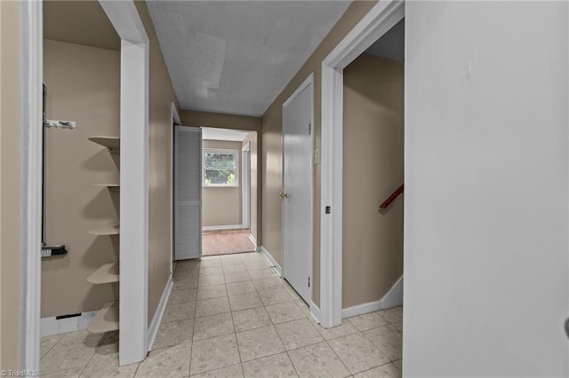 131 Springdale Dr, Stoneville, NC 27048 - hall featuring baseboards and light tile patterned flooring