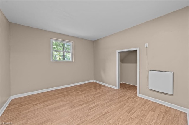 131 Springdale Dr, Stoneville, NC 27048 - spare room with baseboards, heating unit, and light wood-style flooring