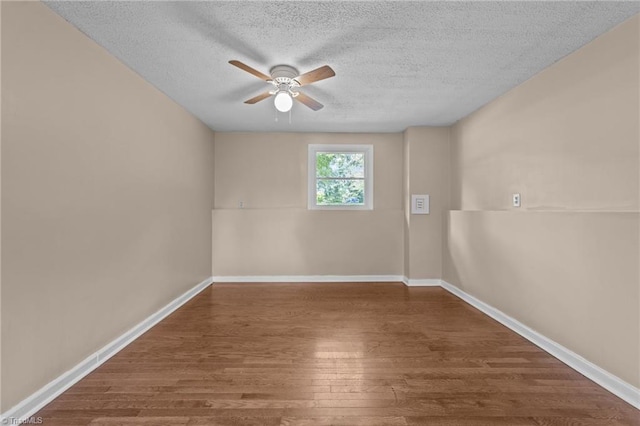 131 Springdale Dr, Stoneville, NC 27048 - empty room with baseboards, a textured ceiling, ceiling fan, and wood finished floors