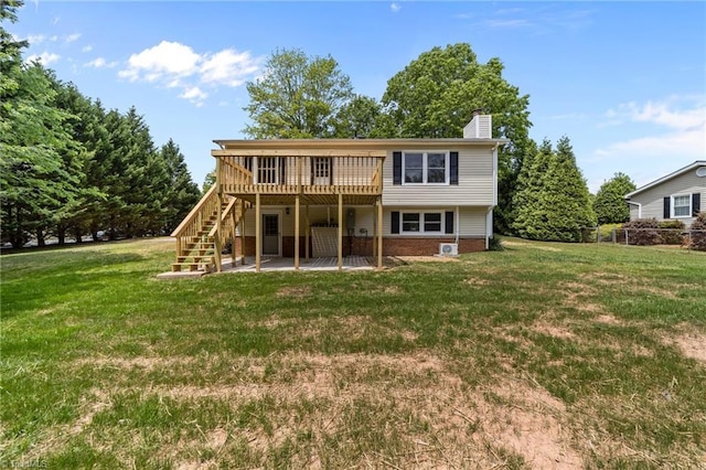 131 Springdale Dr, Stoneville, NC 27048 - rear view of property with stairs, a deck, a chimney, a lawn, and a patio