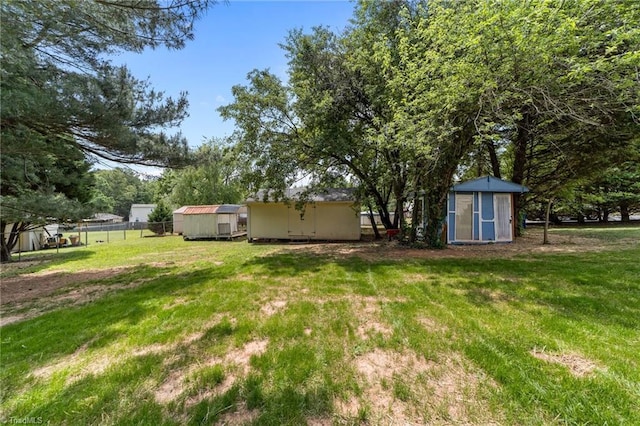 131 Springdale Dr, Stoneville, NC 27048 - view of yard with fence, an outdoor structure, and a shed
