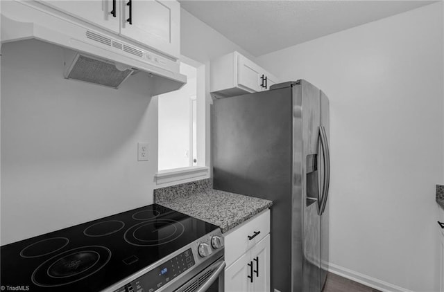 kitchen featuring under cabinet range hood, white cabinetry, stainless steel appliances, and light stone counters