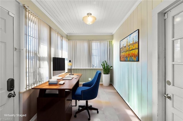 home office with ornamental molding and a healthy amount of sunlight