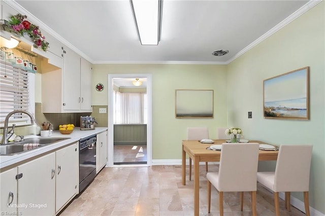 kitchen with tasteful backsplash, white cabinetry, dishwasher, sink, and ornamental molding