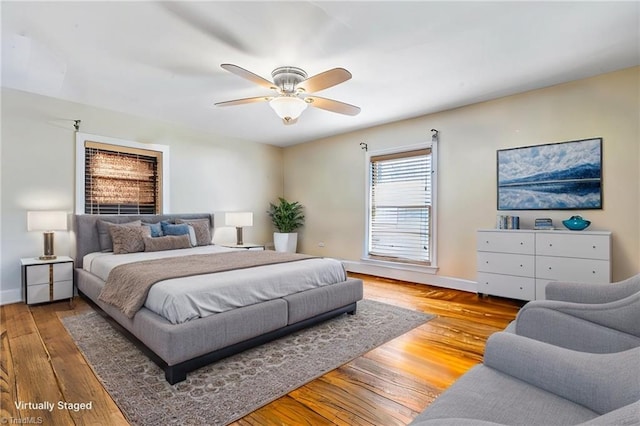 bedroom featuring hardwood / wood-style flooring and ceiling fan