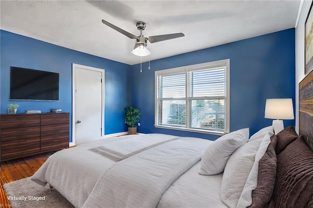 bedroom featuring hardwood / wood-style flooring and ceiling fan