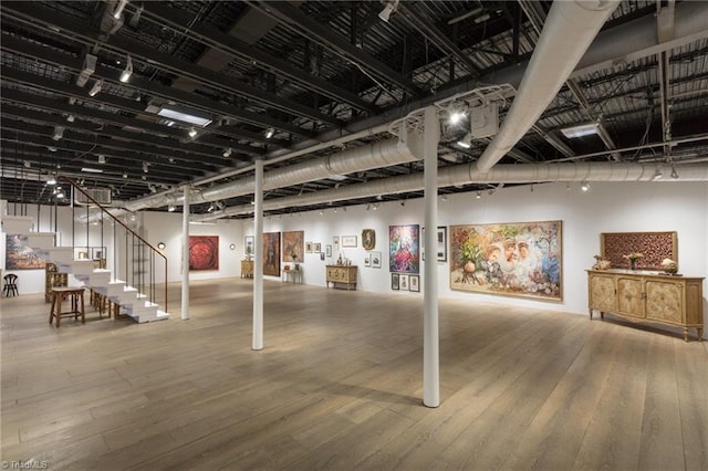 basement featuring wood-type flooring