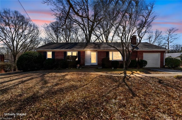 ranch-style home with a garage